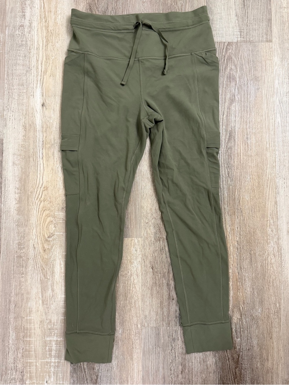 Athleta Salutation Cargo Tight Drawstring Leggings in Olive Green, size LG